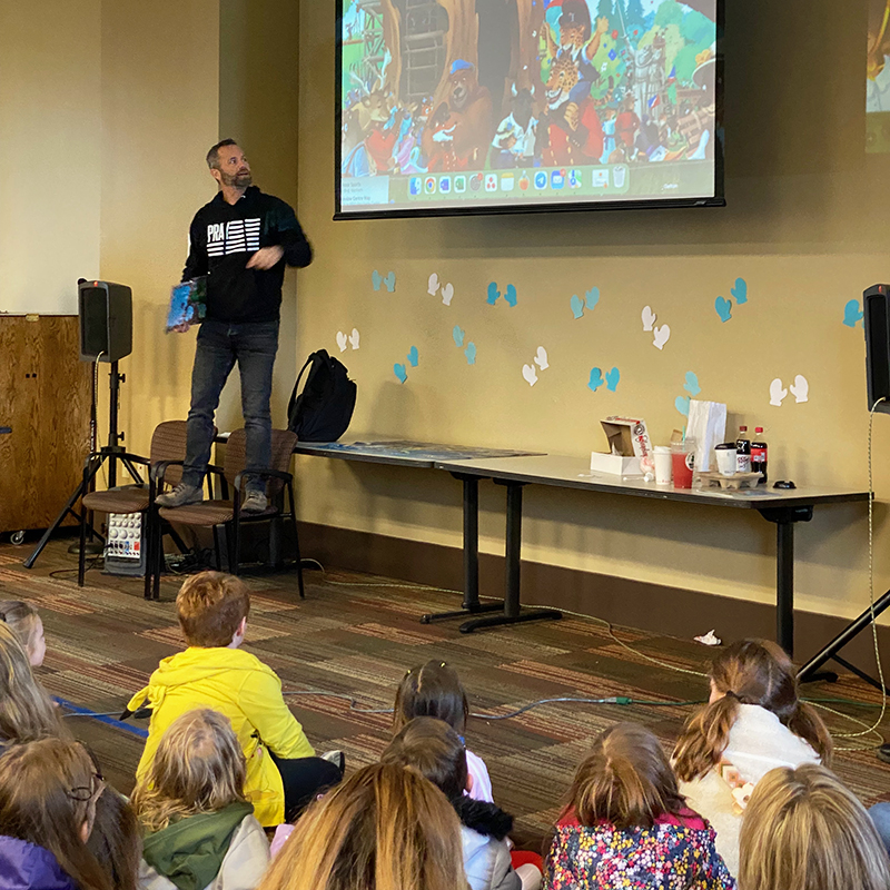 Kirk Cameron reading his book to a room full of children at the Hendersonville library.